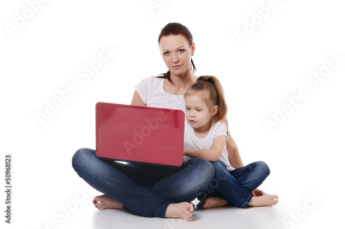 Mum with a daughter at the laptop