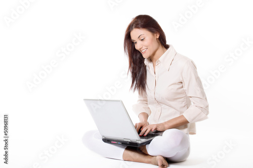 Young woman working with laptop © Sławomir Fajer