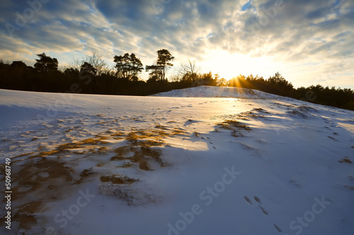 snowy hill at sunset