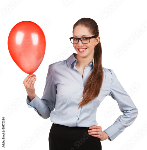 Girl in glasses with red inflated ball photo