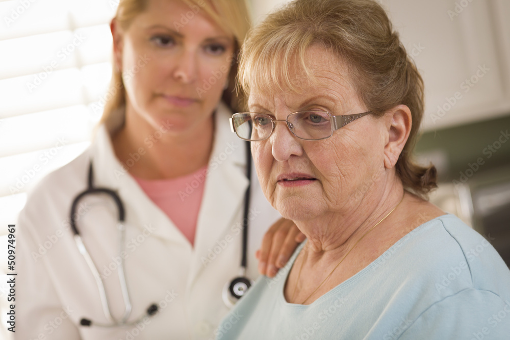 Senior Adult Woman Being Consoled by Female Doctor or Nurse Senior Adult Woman Being Consoled by Female Doctor or Nurse