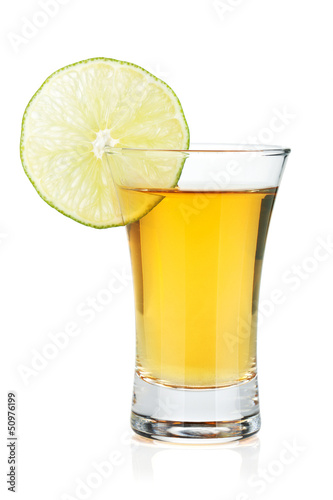 Shot of gold tequila with lime slice