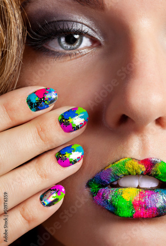 Girl with beautiful multicolor Minx nails and make-up