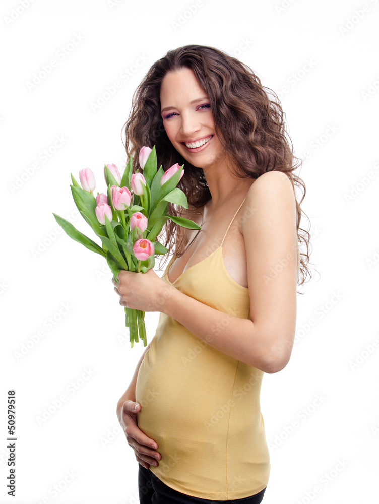 Beautiful pregnant girl with flowers