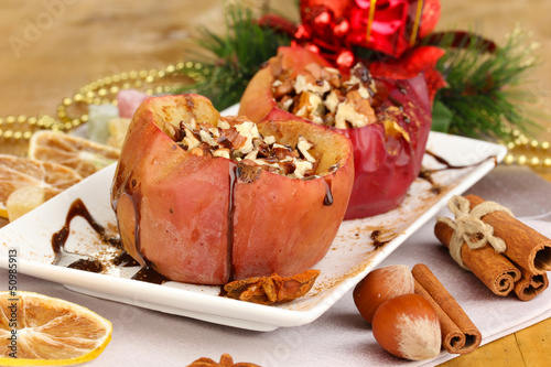 Baked apples on plate close up