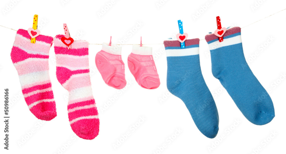 Colorful socks hanging on clothesline, isolated on white Colorful socks hanging on clothesline, isolated on white