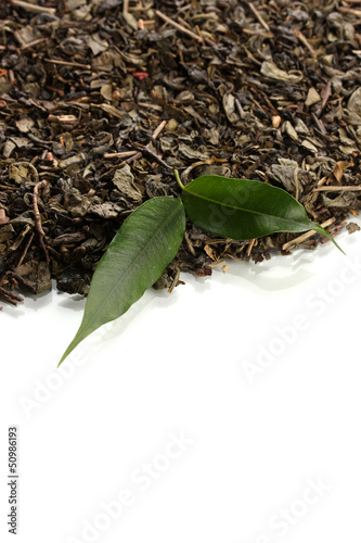 Dry tea with green leaves, isolated on white