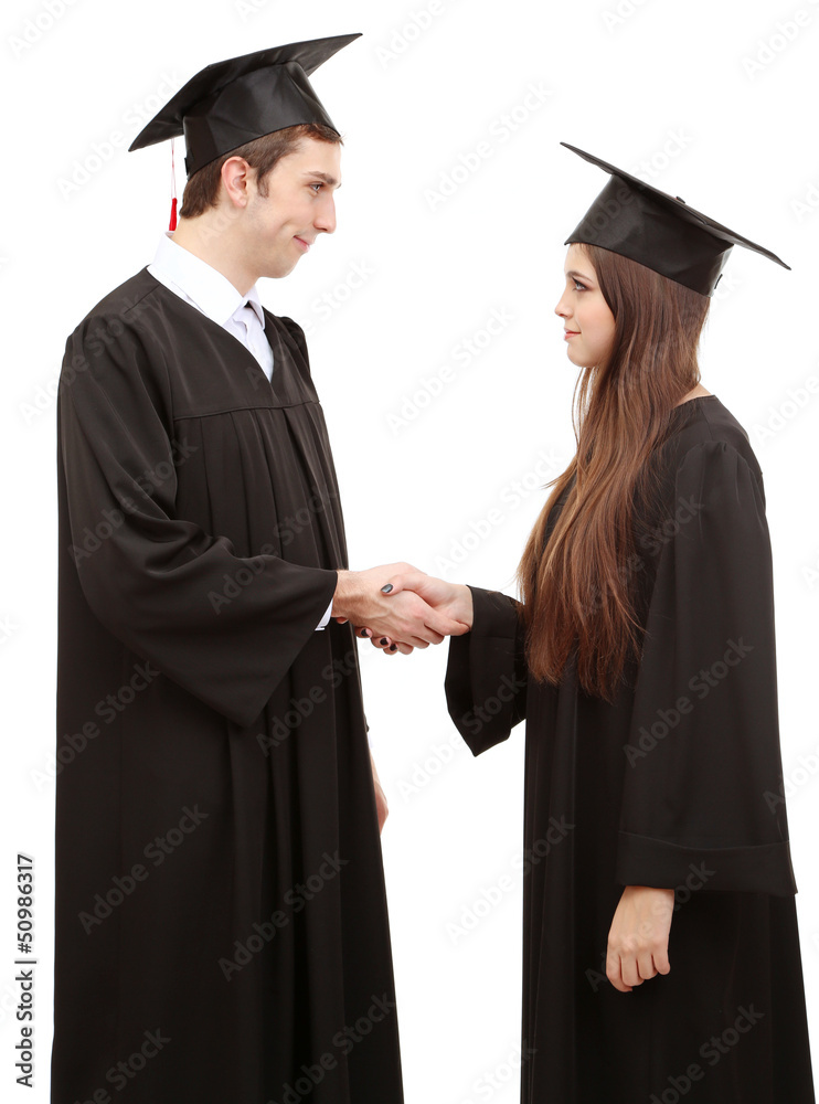 Two happy graduating students isolated on white Two happy graduating students isolated on white