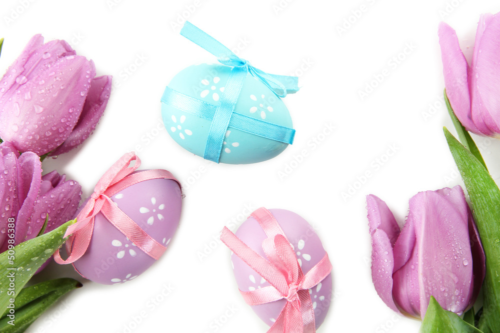 Bright easter eggs and tulips, isolated on white