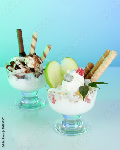 Ice cream with wafer sticks on blue background