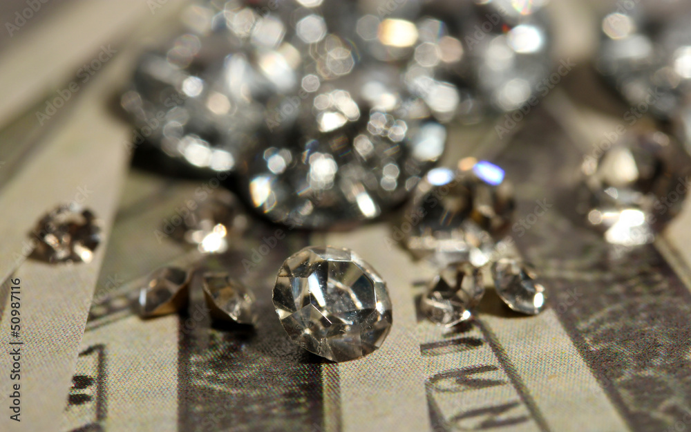 Beautiful shining crystals (diamonds) on money background Beautiful shining crystals (diamonds) on money background