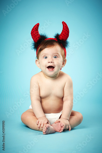 little funny baby with devil horns