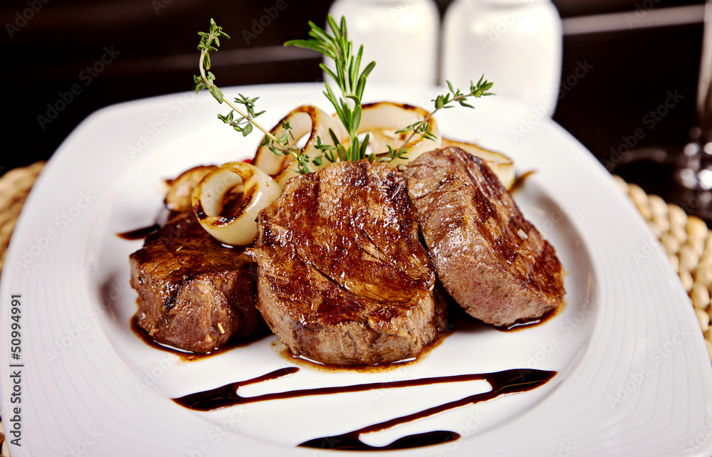Beef steak with soy sauce, rosemary and onion Beef steak with soy sauce, rosemary and onion