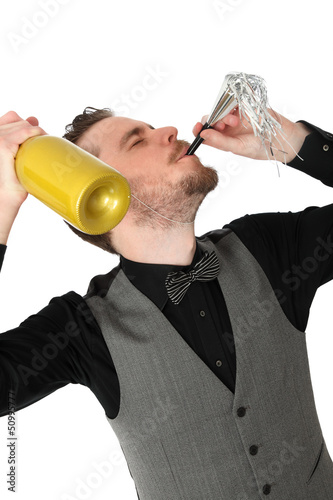 Party guy with partyhorn blower and champagne bottle photo