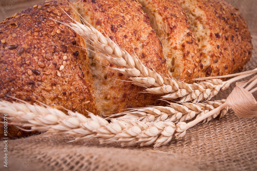 assortment of baked bread on wood table