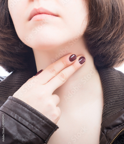 beautiful young woman measures the pulse photo