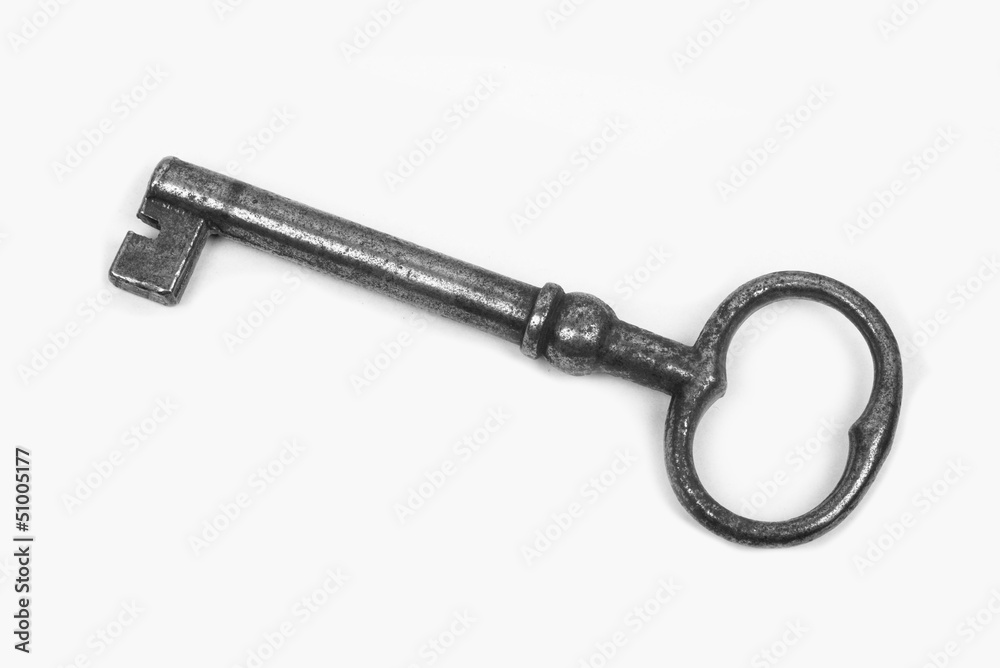 one iron key on a white background one iron key on a white background