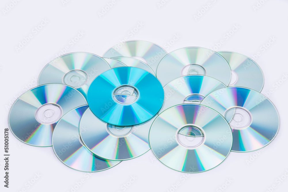 one blue and several normal CD DVD discs one blue and several normal CD DVD discs