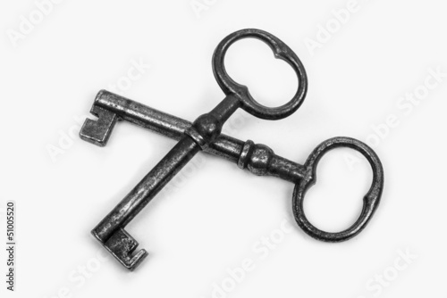 two iron keys on a white background