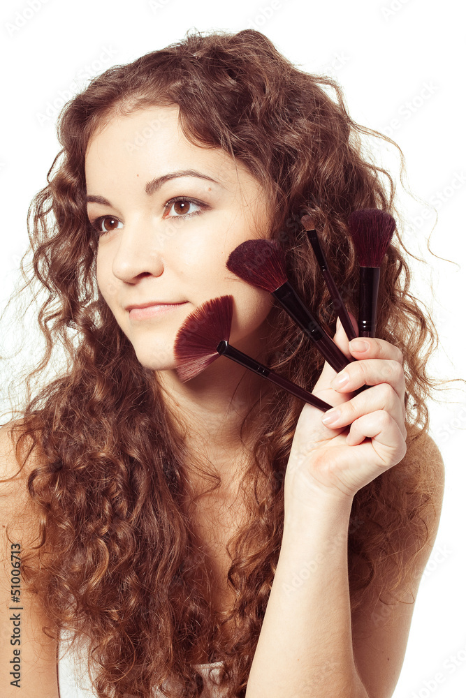 Portrait of young happy smiling woman with make up tools Portrait of young happy smiling woman with make up tools