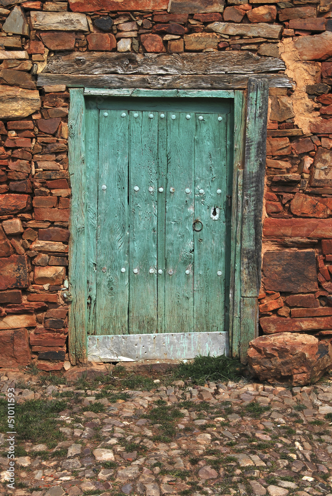 Old door painted in green
