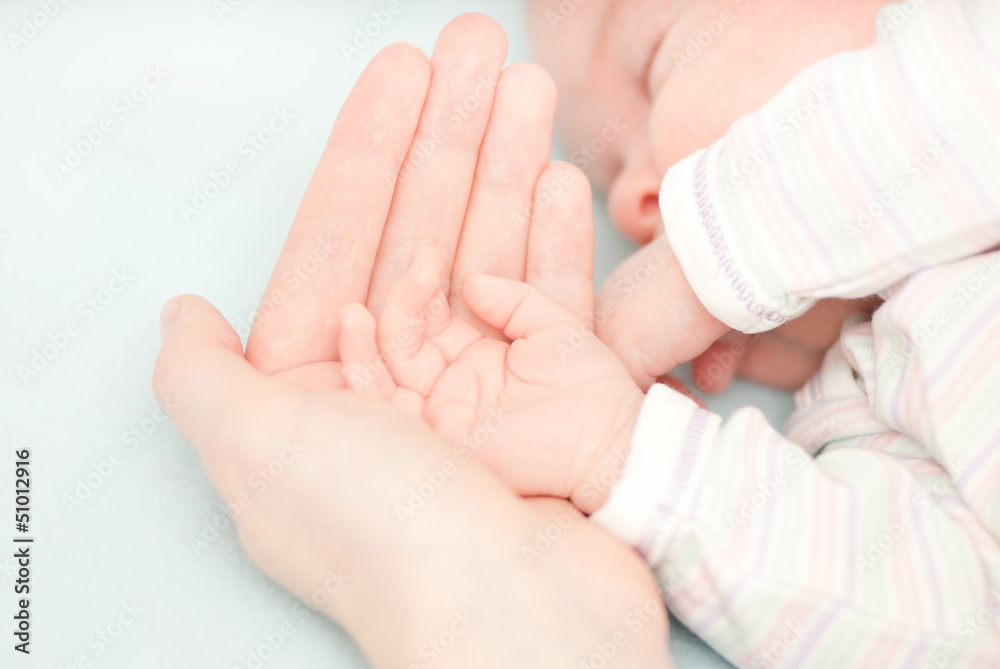 little baby hands and hand of the mother little baby hands and hand of the mother