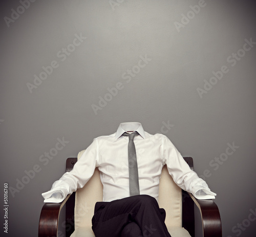 invisible man sitting on armchair