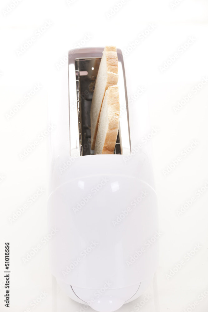 Toast popping out of a toaster Toast popping out of a toaster
