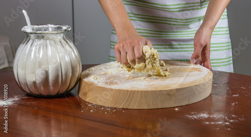 Housewife kneading dough