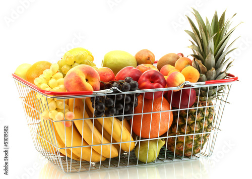 Assortment of exotic fruits in metal basket isolated on white