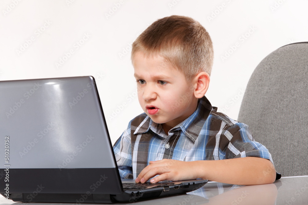 Computer addiction emotional boy with laptop Computer addiction emotional boy with laptop