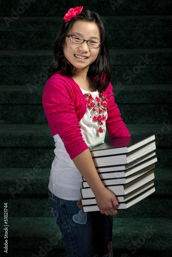 Fényképezés Young girl and books