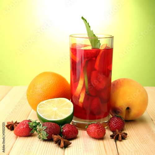 Refreshing sangria in glass with fruits 