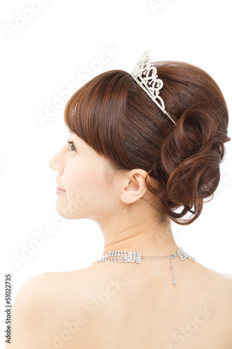 Beautiful asian woman dressed as a bride on white background