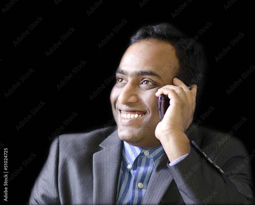 A handsome man talking on cell phone A handsome man talking on cell phone