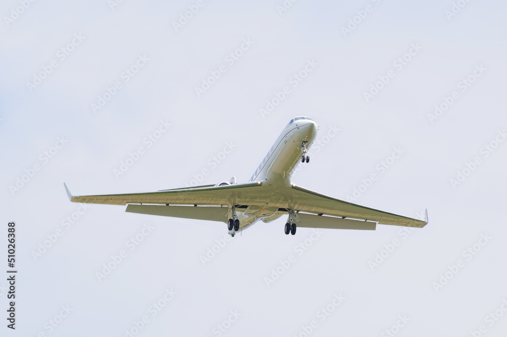 Landing airplane on cloudy sky Landing airplane on cloudy sky
