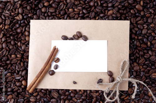 Wallpaper Mural coffee beans in a paper envelope with white card and a stick of Torontodigital.ca