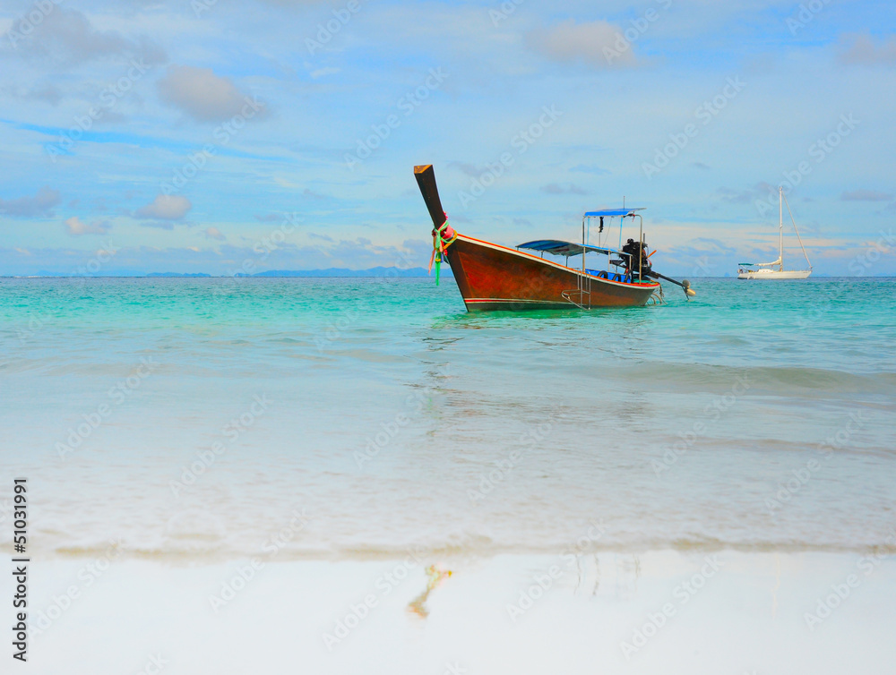 Longtail boat on the sea tropical beach