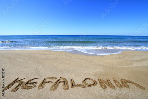 Kefalonia written on sandy beach