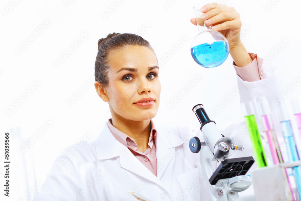 Young female scientist working in laboratory Young female scientist working in laboratory