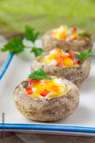 Baked mushrooms stuffed with cheese and vegetables