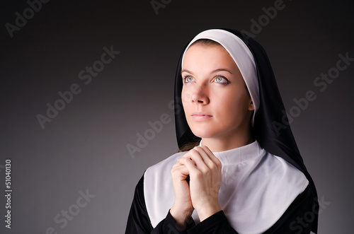 Young nun in religious concept photo