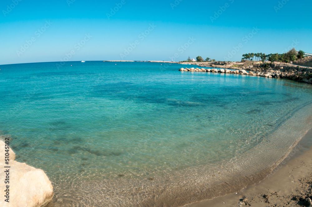 Wide angle view of empty sandy beach in Cyprus, Mediterranean sea