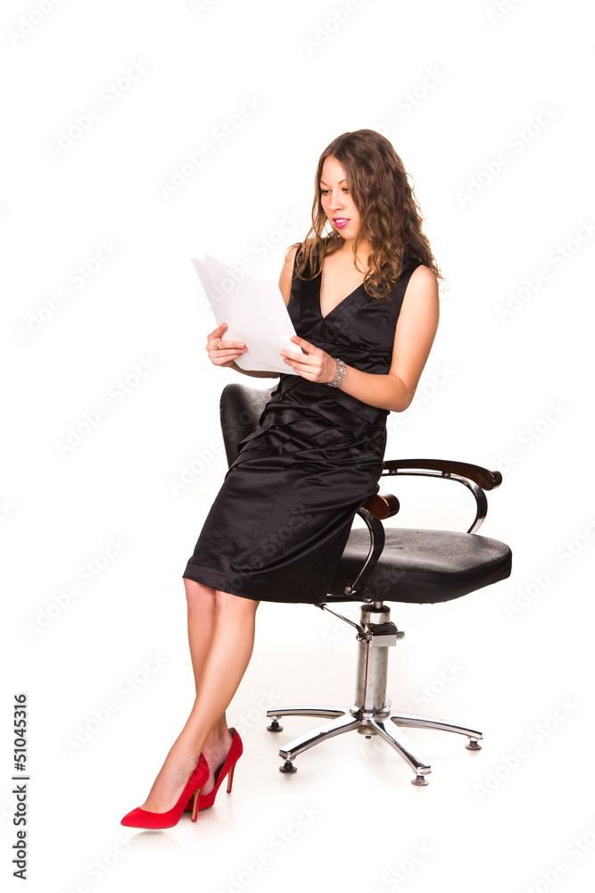 Attractive businesswoman studying paperwork Attractive businesswoman studying paperwork