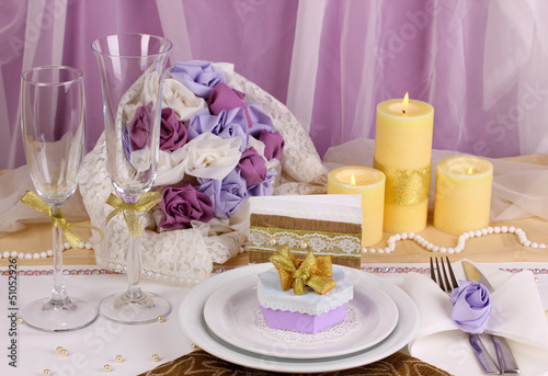 Serving fabulous wedding table in purple and gold color