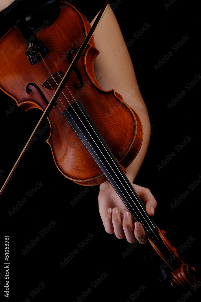 Musician playing violin on black background Musician playing violin on black background