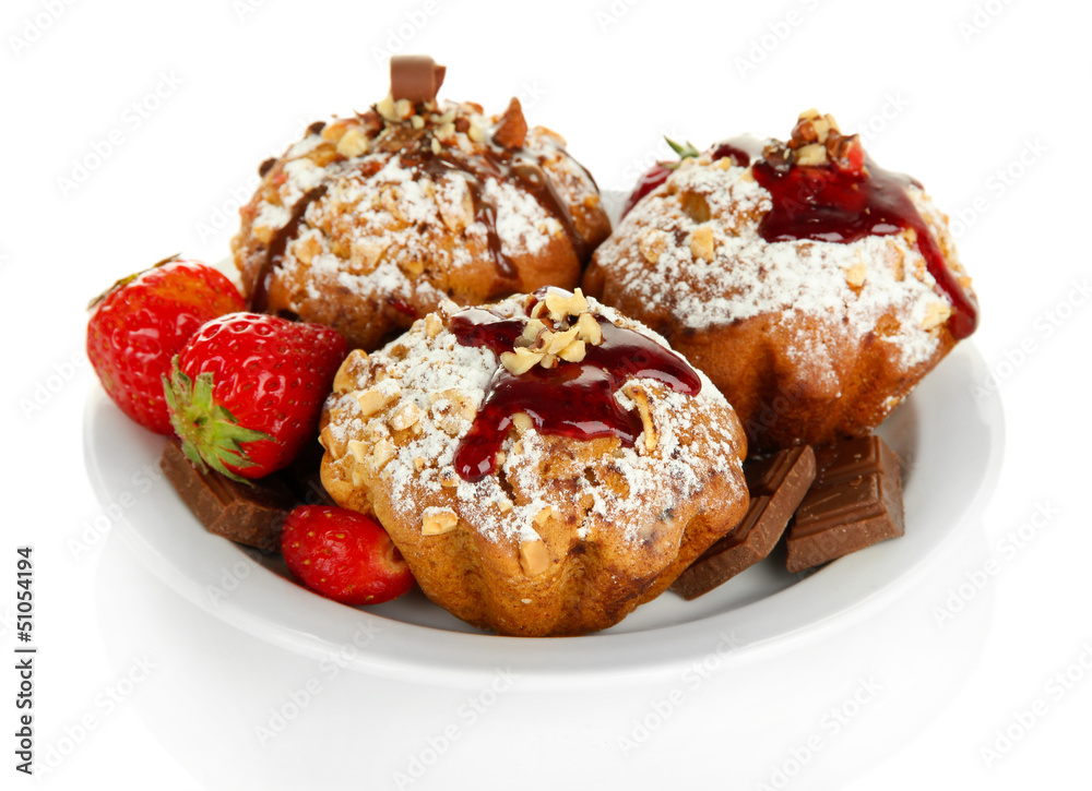 Tasty muffin cakes with strawberries and chocolate