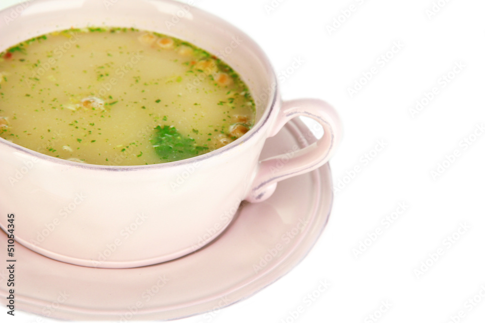 Nourishing soup with vegetables in pan isolated on white Nourishing soup with vegetables in pan isolated on white