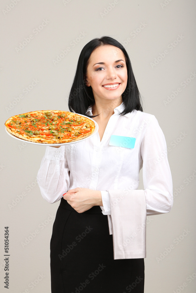 Beautiful girl waiter with pizza isolated on white Beautiful girl waiter with pizza isolated on white
