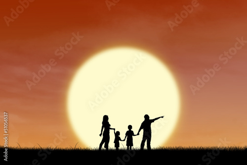 Happy family on sunset silhouette